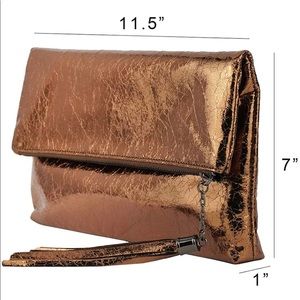 NWT metallic clutch with chain and tassel